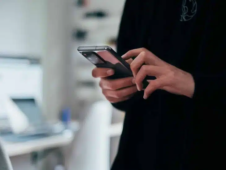 person holding black android smartphone